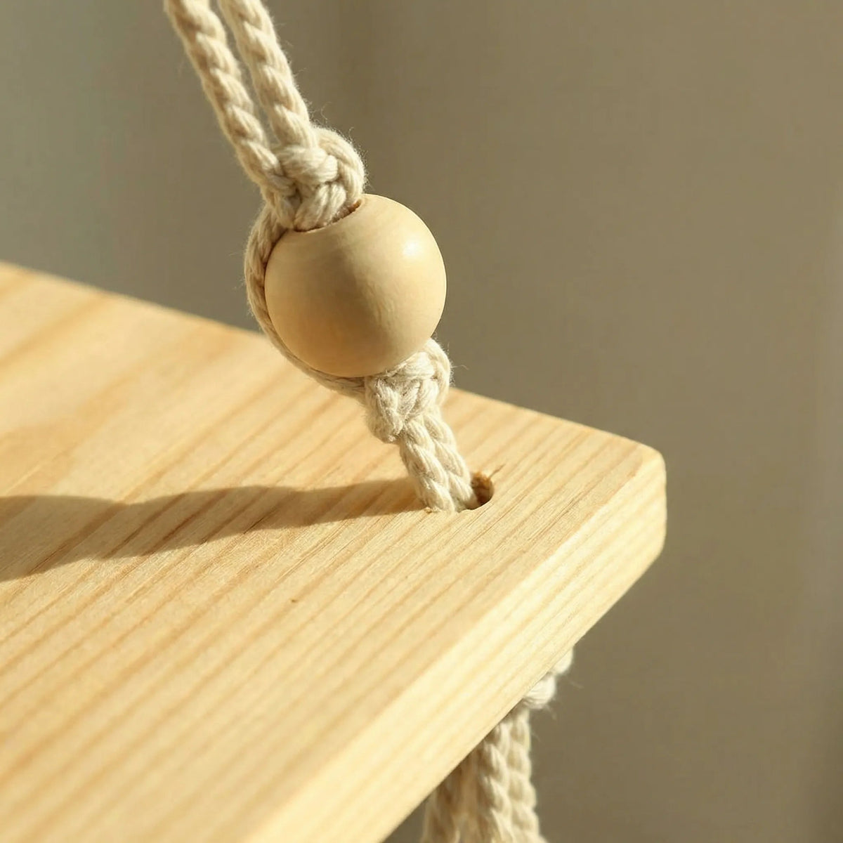 handmade-boho-hanging-wall-shelf-with-braided-cord-and-beads-img3.webp